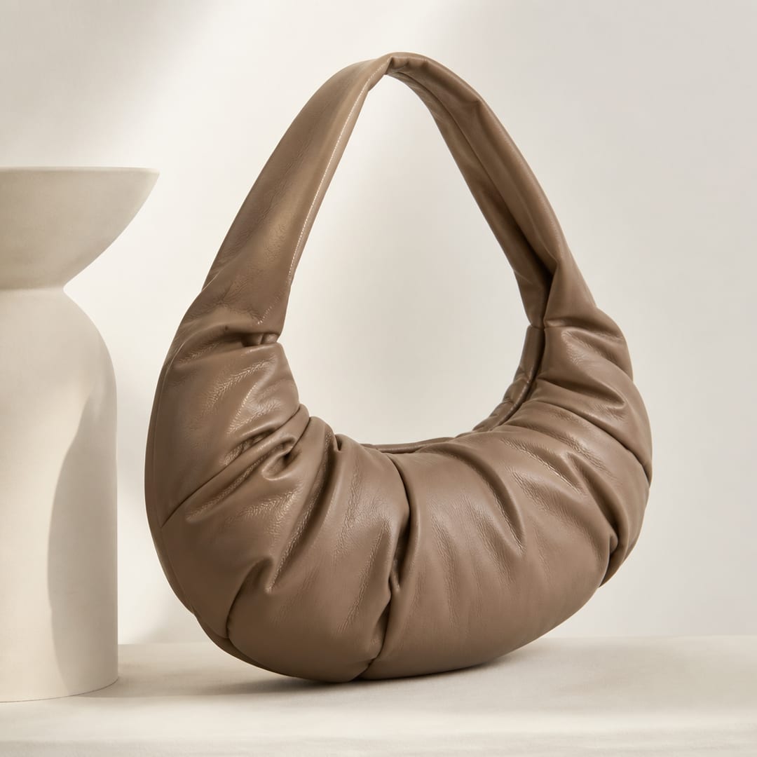 Editorial reference still-life — sculptural bag silhouette study